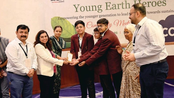 Young Earth Heroes students receiving a community-meetup award
